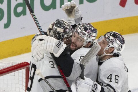 Kings blank Canadiens 4-0, set the NHL record with their 11th straight road win to open season