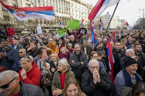 Thousands accuse Serbia's ruling populists of election fraud at a Belgrade rally