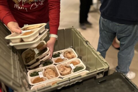 ‘We are all alone at some point’: Volunteers at Basilica of National Shrine deliver Christmas meals to those celebrating alone