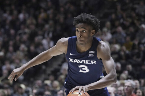 Swain’s dunk caps Xavier comeback win over Georgetown 92-91