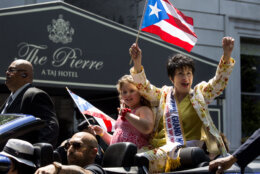 Parade Grand Marshall, actress and entertainer Chita Rivera, waves to people watching the National Puerto Rican Day Parade Sunday June 9, 2013, in New York. (AP Photo/Craig Ruttle)