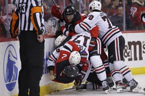 Blackhawks rookie Connor Bedard departs after big hit by Devils defenseman Brendan Smith