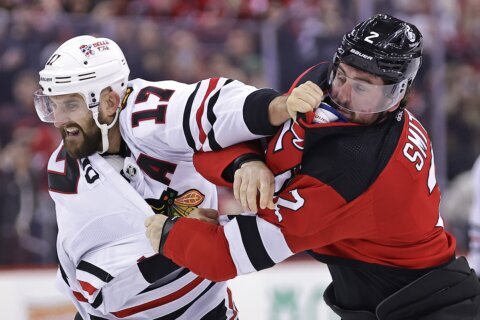 Connor Bedard departs after big hit as Chicago Blackhawks lose 4-2 to New Jersey Devils