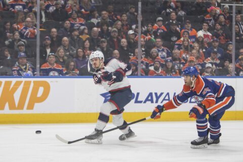 Oilers beat Blue Jackets 4-1 for 14th straight victory, close within 3 wins of the NHL record