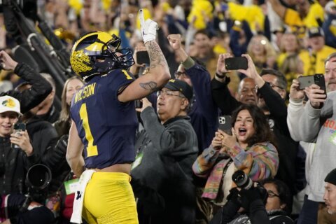 Harbaugh's Michigan Wolverines to play for national title after stopping Alabama 27-20 in OT