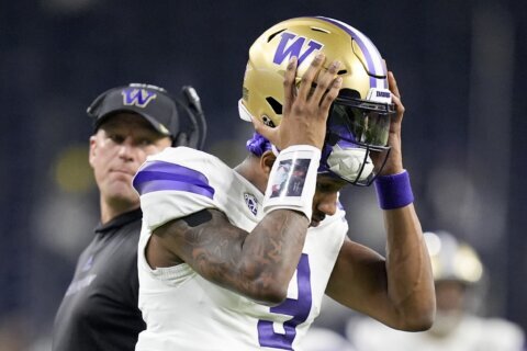 Washington star Michael Penix Jr. takes pounding, disappointing loss in college finale