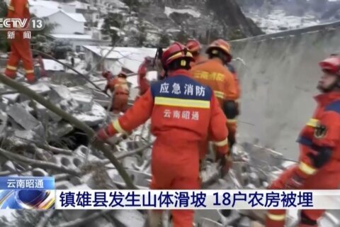 Two survivors rescued after landslide buried homes in freezing weather in southwest China, 11 died