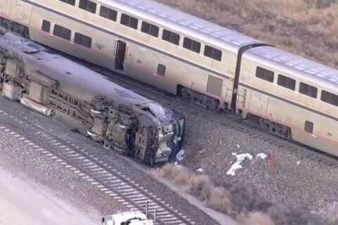 Passenger train hits milk truck at Colorado railroad crossing, badly injuring Amtrak engineer