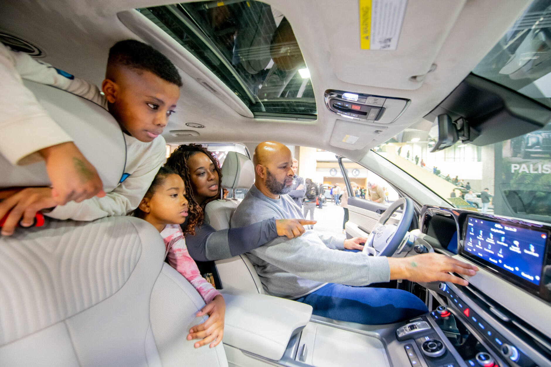 Family inside a vehicle at DC Auto Show