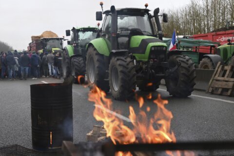 European farmers block French roads and head to Brussels to protest wages and bureaucratic meddling