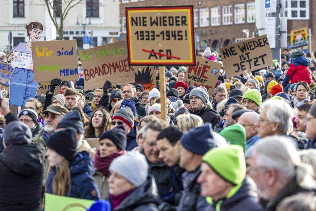 Protests against Germany’s far right draw hundreds of thousands — in Munich, too many for safety