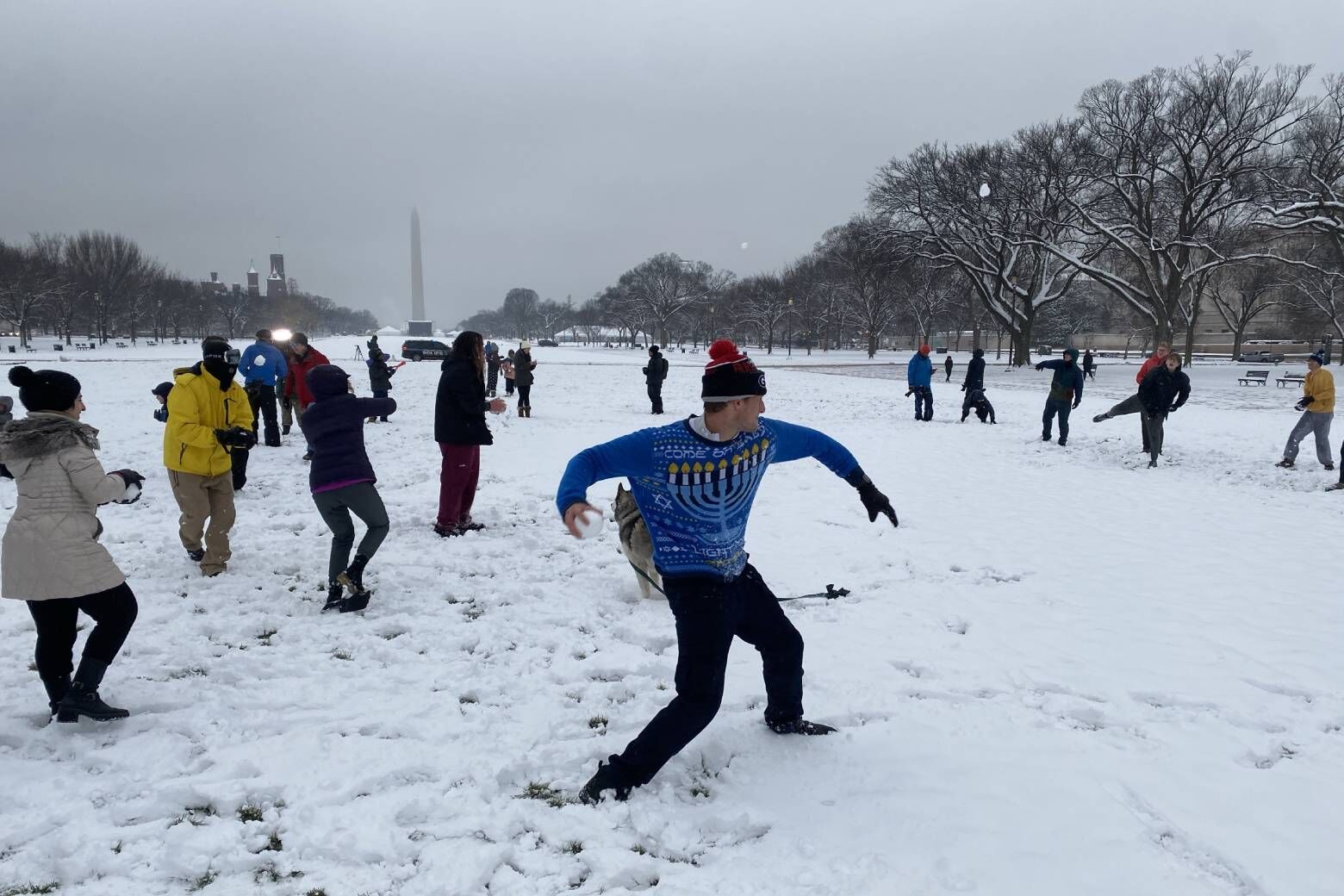 A snowball fight is held on the National Mall