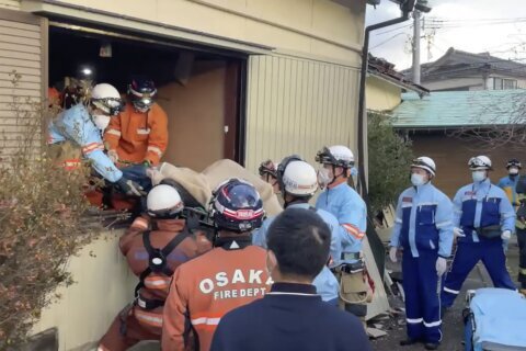 Death toll reaches 100 as survivors are found in homes smashed by western Japan earthquakes