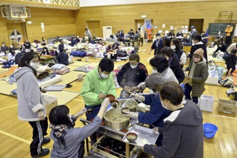 Thousands forced from homes by a deadly Japan earthquake on New Year's face stress and exhaustion