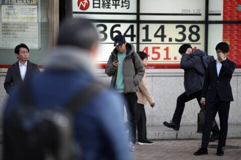 Stock market today: Asian stocks gain after Wall St's latest record. Bank of Japan keeps policy lax