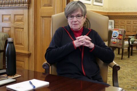 A push to expand Medicaid has Kansas governor embracing politics and cutting against her brand
