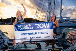Lauren Champion and Lisa Roland hold up new world record banner