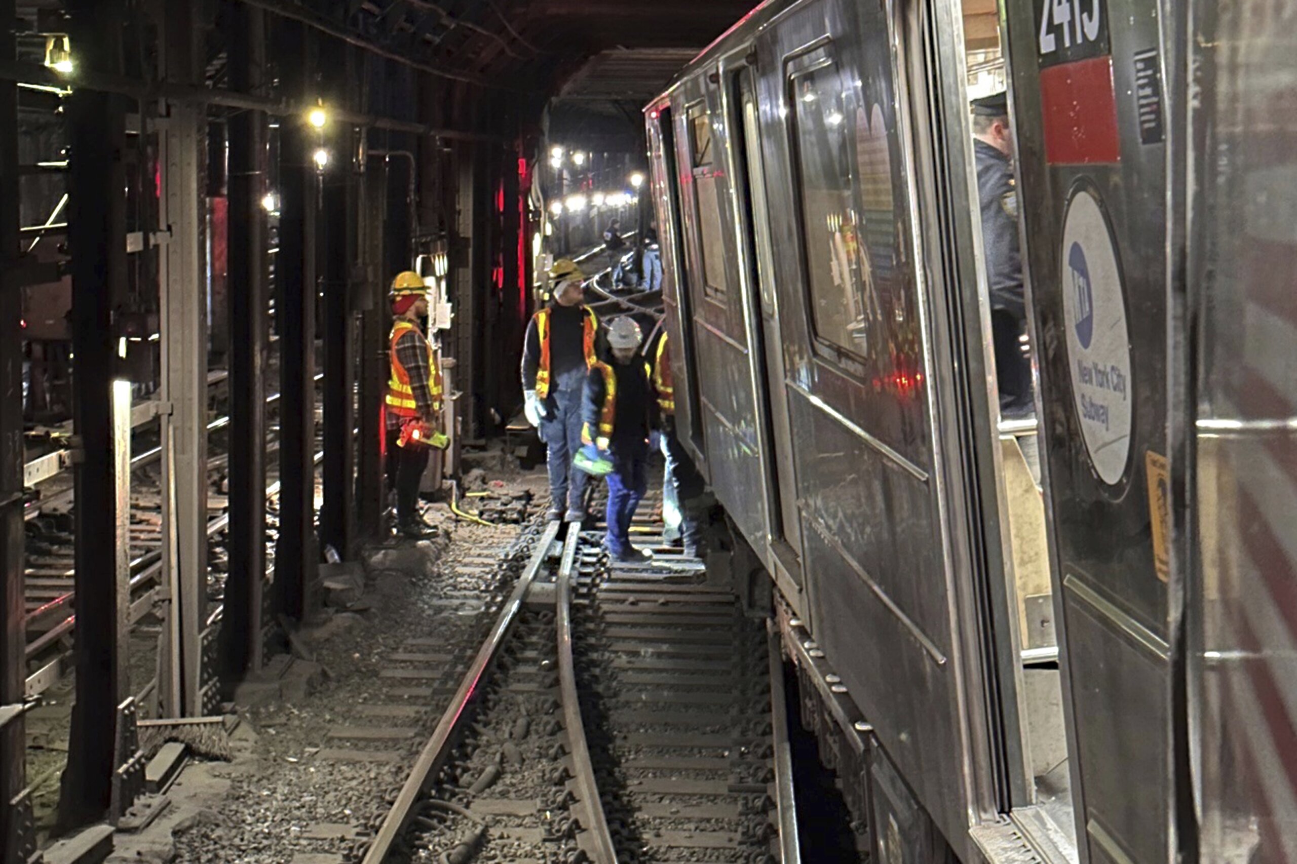 New York City subway train derails in collision with another train, injuring more than 20 people