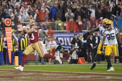 Christian McCaffrey’s 2nd TD rallies the 49ers to 24-21 playoff win over Jordan Love and the Packers