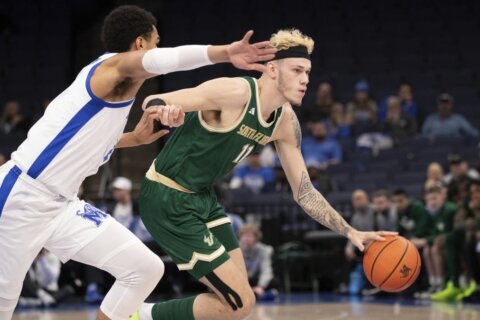 South Florida rallies from 20 down to stun No. 10 Memphis 74-73