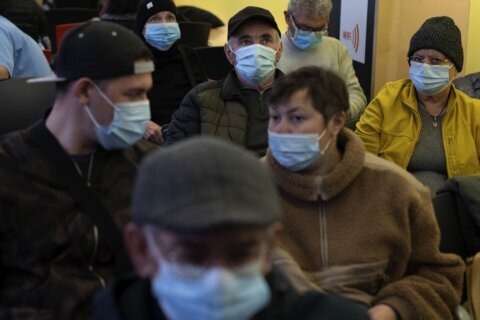 Spain makes face masks mandatory in hospitals and clinics after a spike in respiratory illnesses