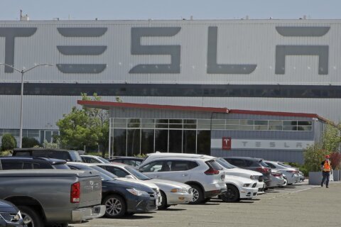 Tesla is raising factory worker pay as auto union tries to organize its electric vehicle plants