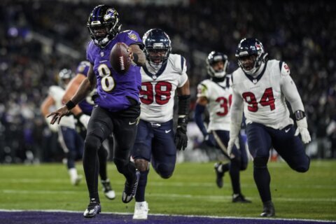 Lamar Jackson and Ravens pull away in the second half to beat Texans 34-10 and reach AFC title game