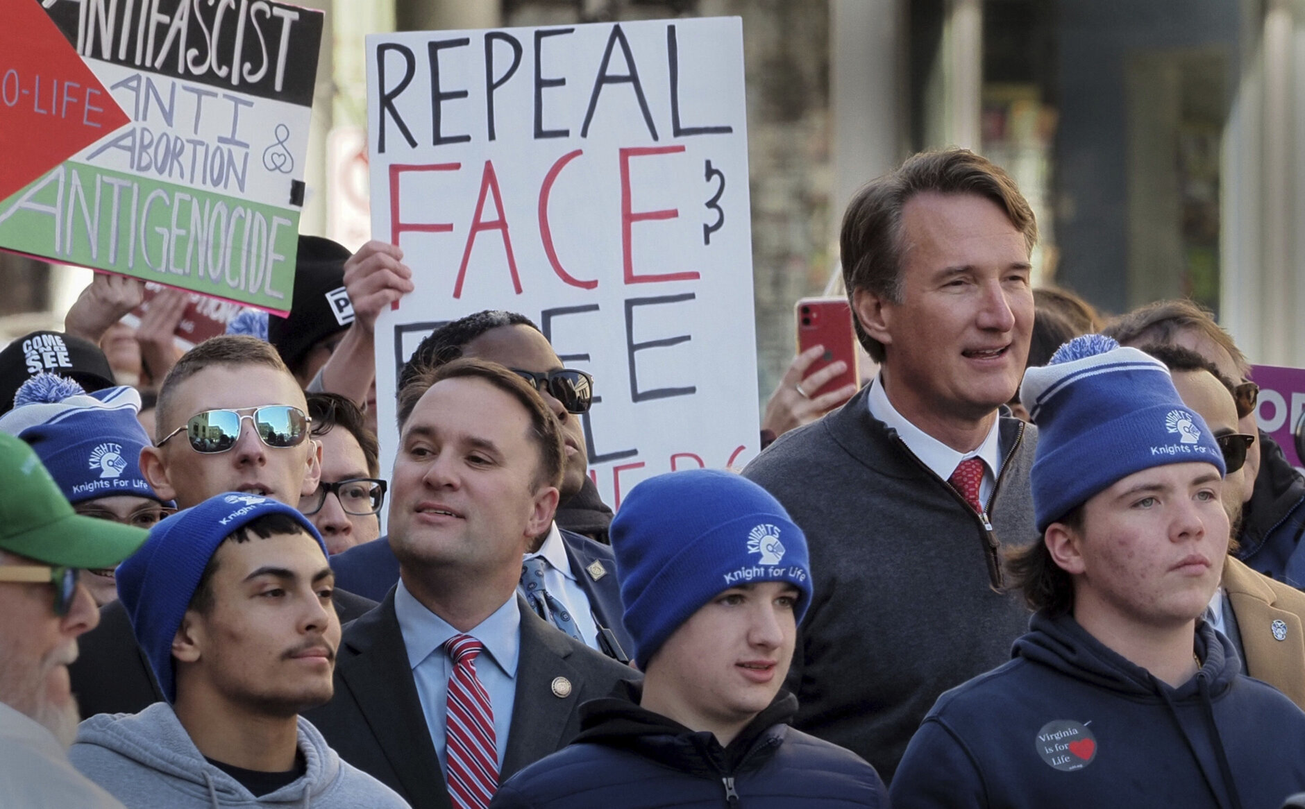 Virginia's Republican Gov. Glenn Youngkin, right, walks with demonstrators during an anti-abortion demonstration at the March for Life event, Wednesday, Feb. 21, 2024, in Richmond, Va. (AP Photo/Jay Paul)
