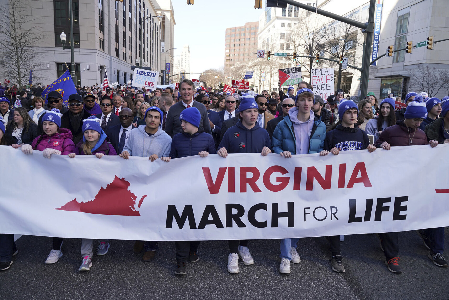 Virginia's Republican Gov. Glenn Youngkin, top center, walks with demonstrators during an anti-abortion demonstration at the March for Life event, Wednesday, Feb. 21, 2024, in Richmond, Va. (AP Photo/Jay Paul)