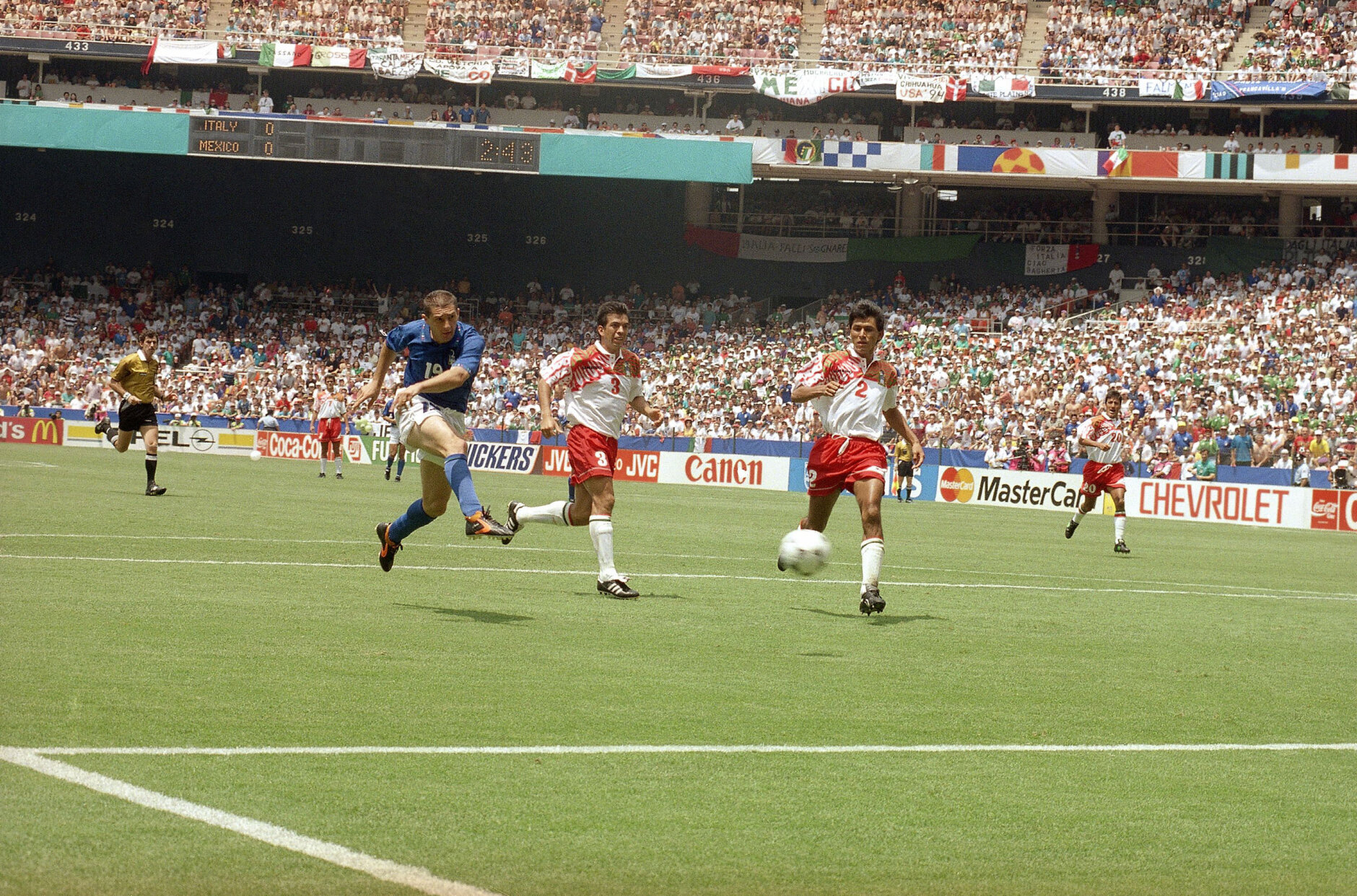 Italy?s Daniele Massaro (19) kicks a second half goal past Mexico?s Juan de Dios Ramirez (3) and Claudio Suarez (2) during the Italy Vs Mexico Group E World Cup match on Tuesday, June 28, 1994 at Washington?s RFK Stadium. Italy and Mexico tied 1-1 and Mexico is advancing to the next round. Italy only placed third in Group E, making the team?s fate yet uncertain. (AP Photo/Luca Bruno)