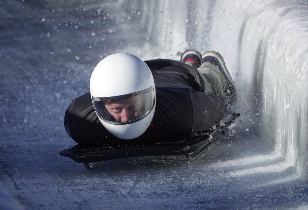 Prince Harry races head-first down a skeleton sled track and says ‘everybody should do this’
