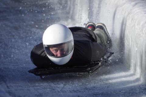 Prince Harry races head-first down a skeleton sled track and says ‘everybody should do this’