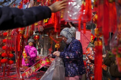 AP PHOTOS: Asia welcomes Lunar New Year of the Dragon with temple visits and celebrations
