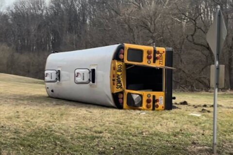 4 students hospitalized after school bus overturns in Howard County