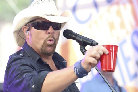 Fans raise a red Solo cup to honor Toby Keith, who immortalized the humble cup in song