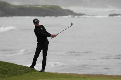 Pebble Beach’s final round is postponed because of rain and raging wind. Wyndham Clark leads by 1