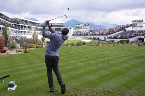 Nick Taylor takes 1-shot lead into Sunday at raucous, waterlogged Phoenix Open