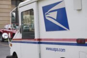 How is the Postal Service dealing with mail-in ballots?