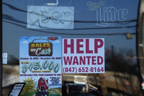 Applications for US jobless benefits fall again as labor market powers on