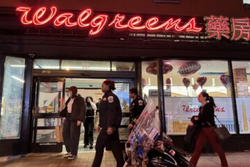 police walk in front of walgreens