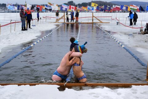 ‘Totally cold’ is not too cold for winter swimmers competing in a frozen Vermont lake