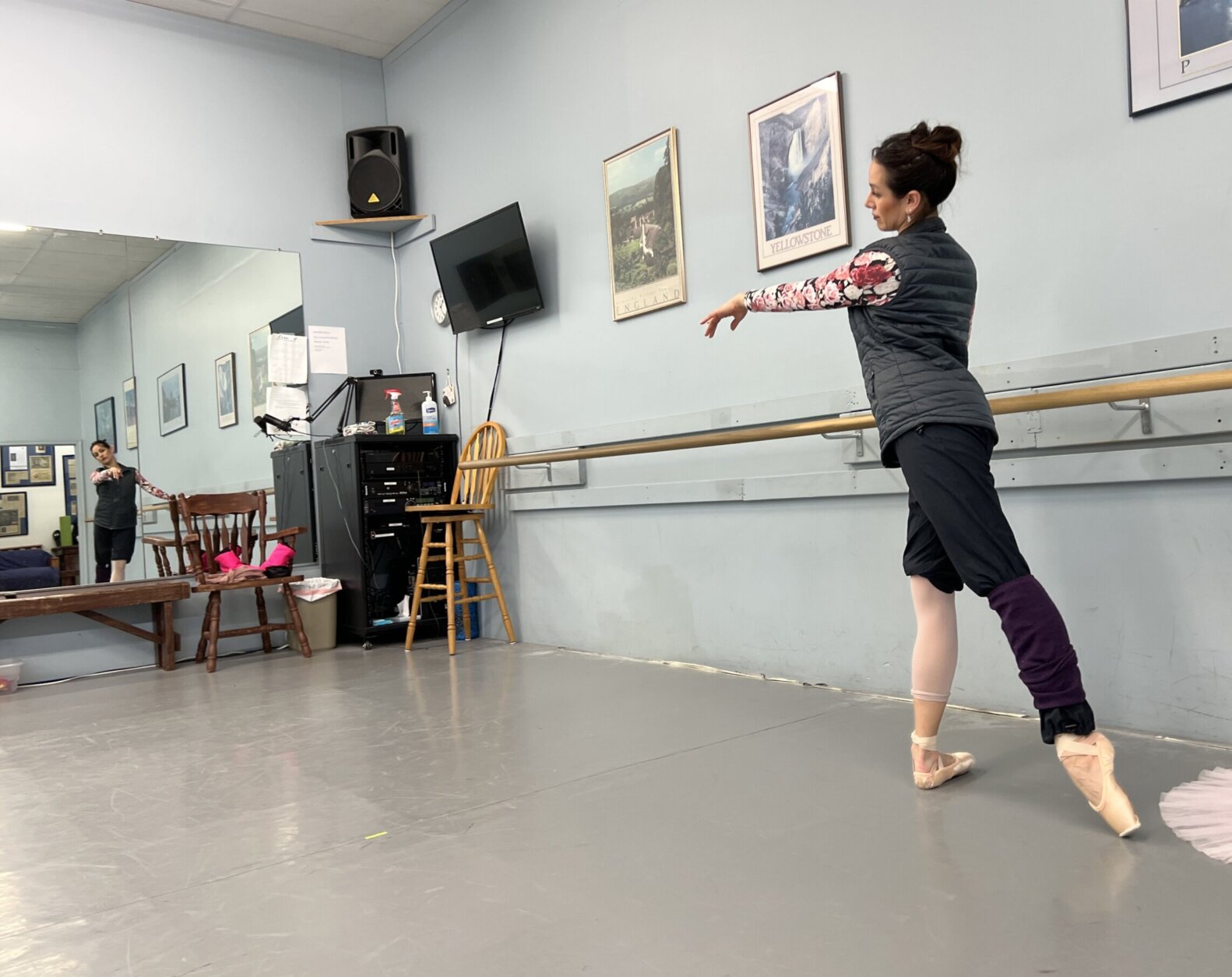 Moya warms up her feet at the barre before performing a solo.