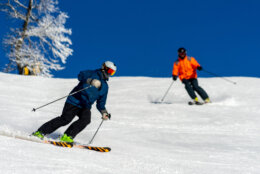two people ski