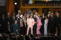 2024 Library of Congress Gershwin Prize for Popular Song honorees Elton John and Bernie Taupin are surrounded by the artists who performed in the Gershwin Prize tribute concert at DAR Constitution Hall on Wednesday, March 20, 2024, in Washington. (AP Photo/Kevin Wolf)