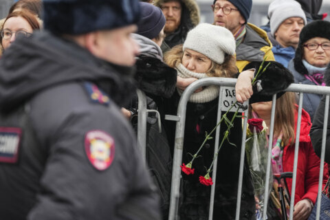 Putin foe Alexei Navalny is buried in Moscow as thousands attend under a heavy police presence