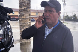 Carlos Suazo Sandoval speaks with a reporter on the phone, Wednesday, March 27, 2024 in Dundalk, Md. One of the construction workers presumed dead in Baltimore was a 38-year-old father and Sandoval's younger brother, Maynor Yassir Suazo Sandoval, who had been in the United States for 18 years but “always dreamed of, in his old age, retiring peacefully in Honduras.” (AP Photo/Brian Witte)