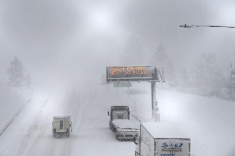 A massive blizzard howls in the Sierra Nevada. High winds and heavy snow close roads and ski resorts
