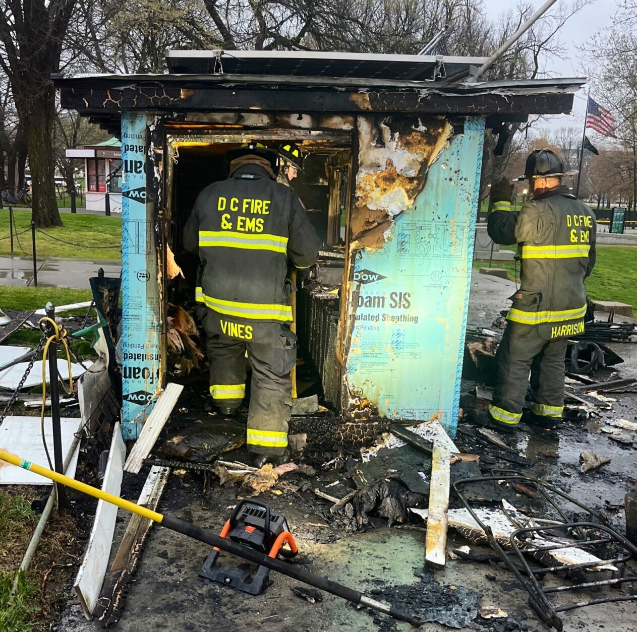Firefighters observe the concession kiosk