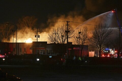 Industrial fire and multiple explosions shoot debris into the air in Detroit suburb