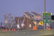 More than 12 hours after Baltimore bridge collapse, governor says search continues for 6 missing workers